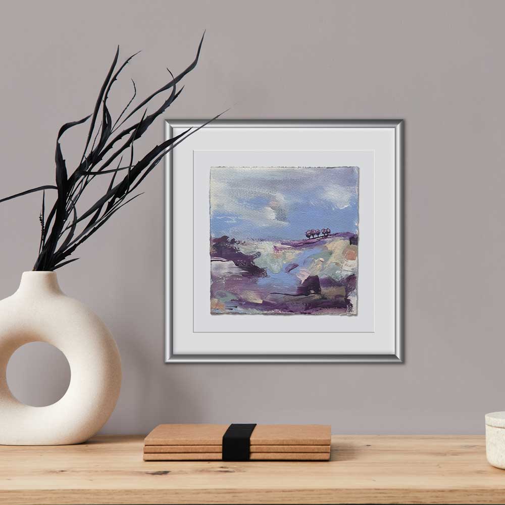 High On A Hill I is an original semi-abstract landscape painting by British Artist Jayne Leighton Herd. A stunning small square tree landscape on textured paper with a deckled edge. Pretty hues of lilac, mauve & dark purple with pops of pale green & pastel pink. Mounted.